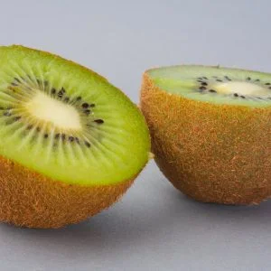sliced green fruit on white surface