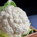 white cauliflower on black textile